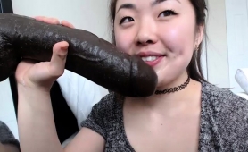 Naughty Asian Camgirl With Nice Tits Sucks A Huge Black Toy