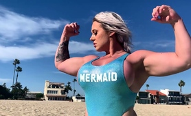 Muscle Blonde Milf Flaunts Amazing Curves On The Beach